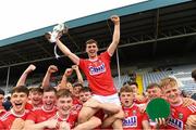 3 August 2019; Cork captain Peter O'Driscoll lifts the cup as his team-mates celebrate after the EirGrid GAA Football All-Ireland U20 Championship Final match between Cork and Dublin at O’Moore Park in  Portlaoise, Laois. Photo by Matt Browne/Sportsfile