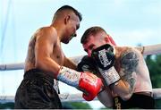 3 August 2019; Paddy Barnes, right, in action against Joel Sanchez during their bantamweight bout at Falls Park in Belfast. Photo by Ramsey Cardy/Sportsfile