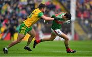 3 August 2019; Jason Doherty of Mayo is tackled by Daire Ó Baoill of Donegal during the GAA Football All-Ireland Senior Championship Quarter-Final Group 1 Phase 3 match between Mayo and Donegal at Elvery’s MacHale Park in Castlebar, Mayo. Photo by Brendan Moran/Sportsfile