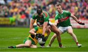 3 August 2019; Michael Langan of Donegal is tackled by Aidan O’Shea and Colm Boyle of Mayo during the GAA Football All-Ireland Senior Championship Quarter-Final Group 1 Phase 3 match between Mayo and Donegal at Elvery’s MacHale Park in Castlebar, Mayo. Photo by Brendan Moran/Sportsfile