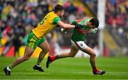 3 August 2019; Jason Doherty of Mayo is tackled by Daire Ó Baoill of Donegal during the GAA Football All-Ireland Senior Championship Quarter-Final Group 1 Phase 3 match between Mayo and Donegal at Elvery’s MacHale Park in Castlebar, Mayo. Photo by Brendan Moran/Sportsfile