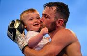 3 August 2019; Padraig McCrory, with his son Fiachra, celebrates his victory against Steve Collins Jr in their BUI Celtic Super-middleweight title bout at Falls Park in Belfast. Photo by Ramsey Cardy/Sportsfile