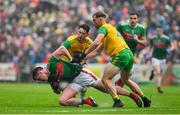 3 August 2019; Cillian O'Connor of Mayo in action against Ryan McHugh and Stephen McMenamin of Donegal during the GAA Football All-Ireland Senior Championship Quarter-Final Group 1 Phase 3 match between Mayo and Donegal at Elvery’s MacHale Park in Castlebar, Mayo. Photo by Brendan Moran/Sportsfile