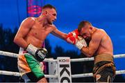 3 August 2019; Sean McComb, left, in action against Renald Garrido during their super-lightweight bout at Falls Park in Belfast. Photo by Ramsey Cardy/Sportsfile