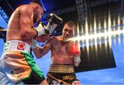3 August 2019; Sean McComb, left, in action against Renald Garrido during their super-lightweight bout at Falls Park in Belfast. Photo by Ramsey Cardy/Sportsfile