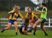 3 August 2019; Molly Mullvihill of Longford  in action against Megan Kelly, left, and Saoirse Wynne and the Roscommon goalkeeper Holly Martin, right, during the All-Ireland Ladies Football Minor B Final match between Longford and Roscommon at Duggan Park in Ballinasloe, Galway. Photo by Ray McManus/Sportsfile