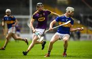 4 August 2019; Bryan O'Mara of Tipperary in action against Cian Fitzhenry of Wexford during the Bord Gáis GAA Hurling All-Ireland U20 Championship Semi-Final match between Tipperary and Wexford at Nowlan Park in Kilkenny. Photo by David Fitzgerald/Sportsfile