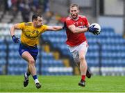 4 August 2019; Ruairi Deane of Cork in action against Niall Kilroy of Roscommon during the GAA Football All-Ireland Senior Championship Quarter-Final Group 2 Phase 3 match between Cork and Roscommon at Páirc Uí Rinn in Cork. Photo by Matt Browne/Sportsfile