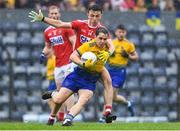 4 August 2019; David Murray of Roscommon in action against Mark Collins of Cork during the GAA Football All-Ireland Senior Championship Quarter-Final Group 2 Phase 3 match between Cork and Roscommon at Páirc Uí Rinn in Cork. Photo by Matt Browne/Sportsfile