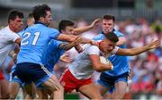 4 August 2019; Michael McKernan of Tyrone is tackled by Eoin Murchan, Michael Darragh MacAuley and Robert McDaid of Dublin during the GAA Football All-Ireland Senior Championship Quarter-Final Group 2 Phase 3 match between Tyrone and Dublin at Healy Park in Omagh, Tyrone. Photo by Brendan Moran/Sportsfile