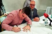 6 August 2019; Boxer Joe Ward, in the company of promoter Lou DiBella, signs his contract during a Times Square Boxing Co. press conference at The Westbury Hotel in Dublin. Photo by Brendan Moran/Sportsfile