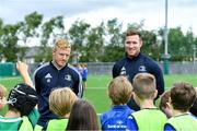 7 August 2019; Leinster players James Tracy, left, and  Rory O’Loughlin with participants during the Bank of Ireland Leinster Rugby Summer Camp at Lansdowne FC in Dublin. Photo by Piaras Ó Mídheach/Sportsfile