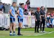 4 August 2019; Bernard Brogan, centre, and Eoghan O'Gara of Dublin await to come on as substitutes during the GAA Football All-Ireland Senior Championship Quarter-Final Group 2 Phase 3 match between Tyrone and Dublin at Healy Park in Omagh, Tyrone. Photo by Brendan Moran/Sportsfile