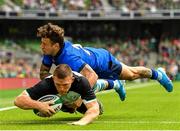 10 August 2019; Andrew Conway of Ireland dives over to score his side's third try, despite the tackle of Matteo Minozzi of Italy, during the Guinness Summer Series 2019 match between Ireland and Italy at the Aviva Stadium in Dublin. Photo by Seb Daly/Sportsfile