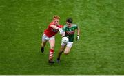 10 August 2019; Mark Tighe of Mayo in action against Ryan O'Donovan of Cork during the Electric Ireland GAA Football All-Ireland Minor Championship Semi-Final match between Cork and Mayo at Croke Park in Dublin. Photo by Daire Brennan/Sportsfile