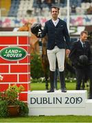 10 August 2019; Mathieu Billot of France, competing on Dassler, celebrates winning the Land Rover Puissance at the Stena Line Dublin Horse Show 2019 at the RDS in Dublin. Photo by Harry Murphy/Sportsfile