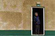 10 August 2019; A gentleman watches from a doorway to get shelter from the elements during the Extra.ie FAI Cup First Round match between St. Michael’s and Glengad United at Cooke Park in Tipperary. Photo by Eóin Noonan/Sportsfile