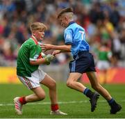 10 August 2019; Elliot Friel, Scoil Iosagáin Buncrana, Inishowen, Donegal, representing Mayo, and Mason Melia, Newtownmountkennedy PS, Newtownmountkennedy, Wicklow, representing Dublin, during the INTO Cumann na mBunscol GAA Respect Exhibition Go Games during the GAA Football All-Ireland Senior Championship Semi-Final match between Dublin and Mayo at Croke Park in Dublin. Photo by Ramsey Cardy/Sportsfile