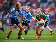 10 August 2019; Caoimhe Kelly, Mullaghrafferty, Carrickmacross, Monaghan, representing Mayo, in action against Sophie English, Mount Anville PS, Stillorgan, Dublin, left, and Layla Stafford, Glynn NS Glynn, Wexford, representing Dublin, during the INTO Cumann na mBunscol GAA Respect Exhibition Go Games during the GAA Football All-Ireland Senior Championship Semi-Final match between Dublin and Mayo at Croke Park in Dublin. Photo by Stephen McCarthy/Sportsfile