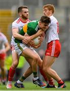 11 August 2019; Seán O'Shea of Kerry is tackled by Ronan McNamee, left, and Peter Harte of Tyrone during the GAA Football All-Ireland Senior Championship Semi-Final match between Kerry and Tyrone at Croke Park in Dublin. Photo by Ramsey Cardy/Sportsfile