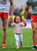 11 August 2019; Chloe Cavanagh, daughter of Colm Cavanagh of Tyrone, left, leaves the pitch after the GAA Football All-Ireland Senior Championship Semi-Final match between Kerry and Tyrone at Croke Park in Dublin. Photo by Brendan Moran/Sportsfile