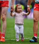 11 August 2019; Chloe Cavanagh, daughter of Colm Cavanagh of Tyrone, leaves the pitch with her father and his team-mate Michael McKernan after the GAA Football All-Ireland Senior Championship Semi-Final match between Kerry and Tyrone at Croke Park in Dublin. Photo by Brendan Moran/Sportsfile