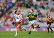 11 August 2019; Ellie Mulroe, Scoil Treasa Senior NS, Firhouse, Dublin, representing Tyrone, in action against Isabel Beaddie, Scoil Neasáin, Baile Hearman, Áth Cliath, representing Kerry, during the INTO Cumann na mBunscol GAA Respect Exhibition Go Games during the GAA Football All-Ireland Senior Championship Semi-Final match between Kerry and Tyrone at Croke Park in Dublin. Photo by Eóin Noonan/Sportsfile