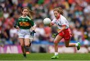 11 August 2019; Ellie Mulroe, Scoil Treasa Senior NS, Firhouse, Dublin, representing Tyrone, in action against Clara Casey, St Patrick’s PS, Pennyburn, 22 Racecourse Road, Derry, representing Kerry, during the INTO Cumann na mBunscol GAA Respect Exhibition Go Games during the GAA Football All-Ireland Senior Championship Semi-Final match between Kerry and Tyrone at Croke Park in Dublin. Photo by Eóin Noonan/Sportsfile