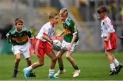 11 August 2019; Aaron Waterhouse, Drimnagh Castle PS, Walkinstown, Dublin, representing Tyrone, in action against Nathan Dunne, Scoil Bhride, Naas, Kildare, representing Kerry, and Ronan Keavey, St. Joseph’s NS, Miltown Malbay, Clare, representing Kerry, during the INTO Cumann na mBunscol GAA Respect Exhibition Go Games during the GAA Football All-Ireland Senior Championship Semi-Final match between Kerry and Tyrone at Croke Park in Dublin. Photo by Ramsey Cardy/Sportsfile