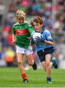 10 August 2019; Cormac Flynn, Scoil Mhuire, Newtownforbes, Longford, representing Dublin,  in action against Charlie McGrath, Ballyholland PS,Newry, Down, representing Mayo, during the INTO Cumann na mBunscol GAA Respect Exhibition Go Games during the GAA Football All-Ireland Senior Championship Semi-Final match between Dublin and Mayo at Croke Park in Dublin. Photo by Sam Barnes/Sportsfile