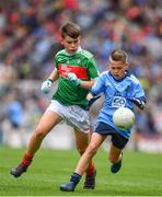 10 August 2019; Dáire Tracey, The Good Shepherd PS, Good Shepherd Road, Antrim, representing Dublin, in action against Cillian Twohig, Kilmeen NS, Clonakilty ,Cork, representing Mayo, during the INTO Cumann na mBunscol GAA Respect Exhibition Go Games during the GAA Football All-Ireland Senior Championship Semi-Final match between Dublin and Mayo at Croke Park in Dublin. Photo by Sam Barnes/Sportsfile