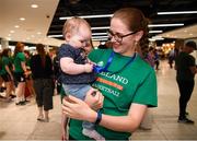 12 August 2019; Strength and conditioning coach with the Ireland basketball bronze medallist squad Elaine Kennington is greeted by her niece 11-month-old Mia O'Carroll on her return from the FIBA U20 Women’s European Championships Division B Finals, held in Kosovo, at Dublin Airport in Dublin. Photo by Stephen McCarthy/Sportsfile