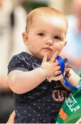 12 August 2019; 11-month-old Mia O'Carroll holds the medal belong to her aunt, strength and conditioning coach with the Ireland basketball bronze medallist squad Elaine Kennington, on the squad's return from the FIBA U20 Women’s European Championships Division B Finals, held in Kosovo, at Dublin Airport in Dublin. Photo by Stephen McCarthy/Sportsfile