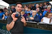 12 August 2019; Michael Darragh MacAuley of Dublin shows off the phone background of supporter Martina McHugh from Blessington, Co Dublin, right, during a meet and greet at Parnell Park in Dublin. Photo by David Fitzgerald/Sportsfile