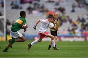 11 August 2019; Turlough Carr, St Francis, Barnesmore, Donegal Town, Donegal, representing Tyrone, and Declan Osagie, Scoil Mhuire, Banríon, Edenderry, Offaly, representing Kerry, during the INTO Cumann na mBunscol GAA Respect Exhibition Go Games during the GAA Football All-Ireland Senior Championship Semi-Final match between Kerry and Tyrone at Croke Park in Dublin. Photo by Ray McManus/Sportsfile