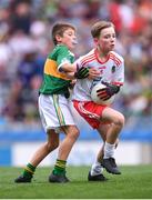 11 August 2019; Conor Bodkin, St. Patricks PS, Tuam, Galway, representing Tyrone, and Nathan Dunne, Scoil Bhride, Naas, Kildare, representing Kerry, during the INTO Cumann na mBunscol GAA Respect Exhibition Go Games at half-time of the GAA Football All-Ireland Senior Championship Semi-Final match between Kerry and Tyrone at Croke Park in Dublin. Photo by Stephen McCarthy/Sportsfile