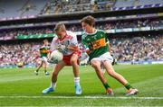 11 August 2019; Aaron Waterhouse, Drimnagh Castle PS, Walkinstown, Dublin, representing Tyrone, and Senan Buckley, Scoil Chros tSeáin, Crosshaven, Cork, representing Kerry, during the INTO Cumann na mBunscol GAA Respect Exhibition Go Games at half-time of the GAA Football All-Ireland Senior Championship Semi-Final match between Kerry and Tyrone at Croke Park in Dublin. Photo by Stephen McCarthy/Sportsfile