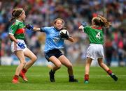 10 August 2019; Sarah Clarke, Farnham NS. Drumelis, Cavan, representing Dublin,  in action against Caoimhe Kelly, Mullaghrafferty, Carrickmacross, Monaghan, representing Mayo, and Caoimhe Gollogly, Our Lady’s & St. Mochua’s PS, Derrynoose, Armagh, representing Mayo, during the INTO Cumann na mBunscol GAA Respect Exhibition Go Games during the GAA Football All-Ireland Senior Championship Semi-Final match between Dublin and Mayo at Croke Park in Dublin. Photo by Ray McManus/Sportsfile