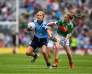 10 August 2019; Sophie English, Mount Anville PS, Stillorgan, Dublin,  in action against Caoimhe Kelly, Mullaghrafferty, Carrickmacross, Monaghan, representing Mayo, during the INTO Cumann na mBunscol GAA Respect Exhibition Go Games during the GAA Football All-Ireland Senior Championship Semi-Final match between Dublin and Mayo at Croke Park in Dublin. Photo by Ray McManus/Sportsfile