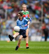 10 August 2019; Erin Casey, Ballyclough NS, Ballyclough, Cork, representing Dublin, in action against Caoimhe Kelly, Mullaghrafferty, Carrickmacross, Monaghan, representing Mayo, during the INTO Cumann na mBunscol GAA Respect Exhibition Go Games during the GAA Football All-Ireland Senior Championship Semi-Final match between Dublin and Mayo at Croke Park in Dublin. Photo by Ray McManus/Sportsfile