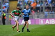 10 August 2019; Aisling McWeeney, Drumcong NS, Drumcong, Leitrim, representing Mayo, and Maggie Holland, Rampark NS, Dundalk, Louth, representing Dublin, during the INTO Cumann na mBunscol GAA Respect Exhibition Go Games during the GAA Football All-Ireland Senior Championship Semi-Final match between Dublin and Mayo at Croke Park in Dublin. Photo by Piaras Ó Mídheach/Sportsfile
