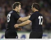 8 November 2003; Leon MacDonald, left, New Zealand, is congratulated by team-mate Aaron Mauger on scoring his sides first try against South Africa. 2003 Rugby World Cup, Quarter Final, New Zealand v South Africa, Telstra Dome, Melbourne, Victoria, Australia. Picture credit; Brendan Moran / SPORTSFILE *EDI*