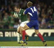 9 November 2003; Kevin Maggs, Ireland, holds off the challenge of Aurelien Rougerie, France, on his way to scoring his sides first try. 2003 Rugby World Cup, Quarter Final, France v Ireland, Telstra Dome, Melbourne, Victoria, Australia. Picture credit; Brendan Moran / SPORTSFILE *EDI*