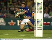 9 November 2003; Kevin Maggs, Ireland, scores his sides first try despite the tackles of Nicolas Brusque and Aurelien Rougerie, France. 2003 Rugby World Cup, Quarter Final, France v Ireland, Telstra Dome, Melbourne, Victoria, Australia. Picture credit; Brendan Moran / SPORTSFILE *EDI*