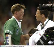 9 November 2003; Ronan O'Gara, Ireland, is attended to by team doctor Gary O'Driscoll in the first half. 2003 Rugby World Cup, Quarter Final, France v Ireland, Telstra Dome, Melbourne, Victoria, Australia. Picture credit; Brendan Moran / SPORTSFILE *EDI*