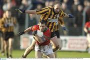 9 November 2003; Mark Doyle, Rathnew, is tackled by Round Towers' Glenn Ryan. AIB Leinster Club Football Championship, Rathnew v Round Towers, County Grounds, Aughrim, Co. Wicklow. Picture credit; Matt Browne / SPORTSFILE *EDI*