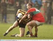9 November 2003; Karl O'Dwyer, Round Towers, is tackled by Rathnew's Clifford Murphy. AIB Leinster Club Football Championship, Rathnew v Round Towers, County Grounds, Aughrim, Co. Wicklow. Picture credit; Matt Browne / SPORTSFILE *EDI*