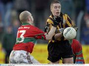 9 November 2003; Mark Scanlon, Round Towers, is tackled by Rathnew's Timmy Gill. AIB Leinster Club Football Championship, Rathnew v Round Towers, County Grounds, Aughrim, Co. Wicklow. Picture credit; Matt Browne / SPORTSFILE *EDI*