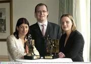 10 November 2003; Christina Heffernan, Mayo football, and Eimear McDonnell, right, Tipperary camogie, with Vodafone Sponsorship Executive Enda Lynch after winning the Vodafone GAA Player of the Year Award's. Westin Hotel, Dublin. Picture Credit; David Maher / SPORTSFILE *EDI*