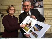 10 November 2003; Special Olympics athlete Catriona Ryan shows an Taoiseach Bertie Ahern T.D. a picture of her in Midsummer Magic at the launch of the book. Bank of Ireland, House of Lords, Dublin. Picture credit; Pat Murphy / SPORTSFILE *EDI*